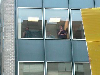 Office workers watch us demonstrate from their building. We, meanwhile, urged them to come out and join us. After all, I took the day off from my office to protest the war - they should, too!