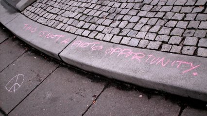 "This is not a photo opportunity" written in pink chalk at the edge of the fountain. I believe that they left out the word "just" in here, because while photographs are certainly beneficial to any movement's public events, it shouldn't be the end all. This is not something to just get a few photos of and be done with. To the contrary, anti-war protests are part of a larger anti-war movement.