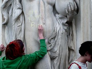 Writing "love your body" in chalk on the fountain.