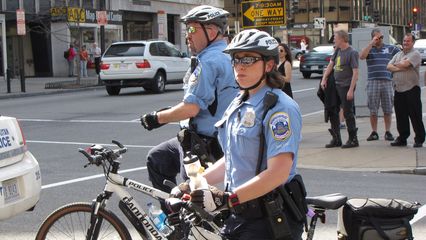 Cops were doing their darndest to keep us on the sidewalk and out of traffic.