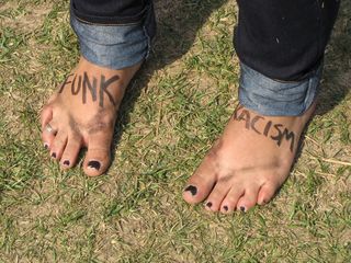 One participant decorated her feet with the words "FUNK RACISM".