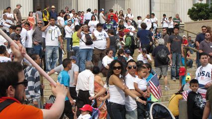 Crowds of people on the steps of the Natural History Museum.