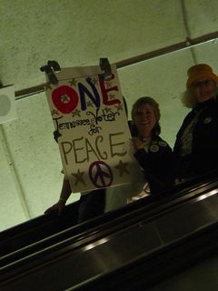 As I was leaving Rosslyn on the escalator, this group entered the Metro carrying protest signs.