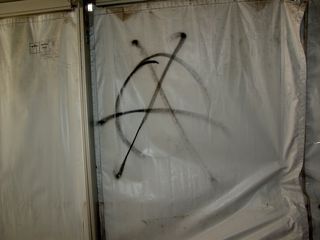 The tunnel is tagged with the anarchy sign!
