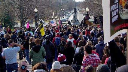 The black bloc, along with a significant amount of mainstream marchers, returns to the street.