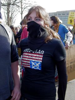 In the street, I ran into the first person I saw wearing the Anti-Flag shirt, now masked up.