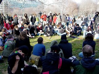 The black bloc convenes in the grass by 3rd Street NW, with the goal of restoring direction to our march.