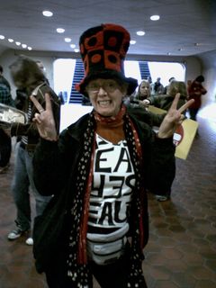 In the station mezzanine, it was full of protesters ready to go home, buying farecards and asking for directions. Meanwhile, I got a photo of this woman giving the peace sign.