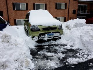 On February 12, the biggest snowfall of the year began, which ended up dropping around a foot of snow.  I couldn't get a spot next to my building before the storm, so I parked across the lot.  After the snow ended, I went to work digging myself out.