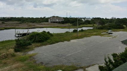 My friend Pete waits in the Soul while I photograph the abandoned Pilot House restaurant.  This photo was taken from one of the decks outside the building.