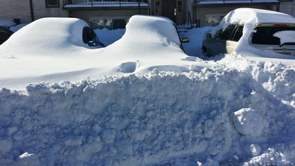 On January 24, the storm was over, and thus began the task of getting out.  Before even dealing with the car, I had to clear a three-foot pile of snow that projected eight feet out in front of the car.  Some of that snow was compressed by plowing efforts, which made it more challenging to break up.