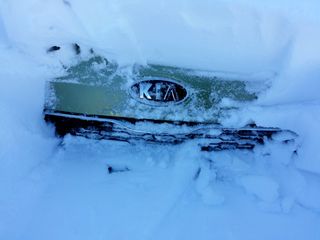 Two milestones in the snow removal: finding the "reserved" marking in my parking space, and finding the hood of the car.