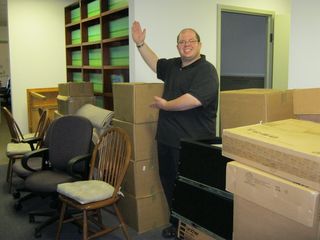 Standing in the office with all of the stuff that we brought back from New Hampshire. I was still a bit round, but certainly showing improvement compared to where I was before.