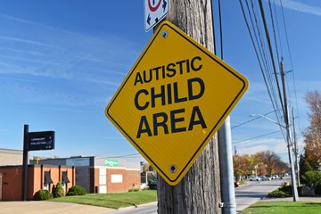 The "Autistic Child Area" sign, on Edinborough Street in front of Bertoni Chairs and Things.