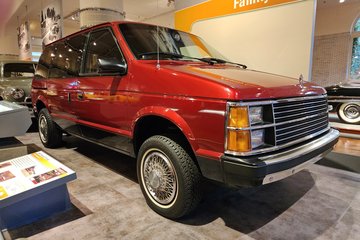 First-generation Plymouth Voyager minivan from the 1980s.  This vehicle was also sold as the Dodge Caravan.  The modern equivalent is the Chrysler Pacifica.