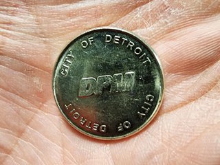 My fare token for the Detroit People Mover.