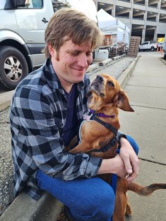 Juni says hello to Chris after he came out of the farmers' market.