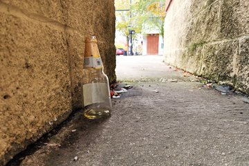 I spotted a beer bottle behind the building's facade before continuing on.