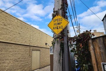 My reference photo for a "speed hump ahead" sign.  This sign was specifically featured on SpinnWebe (as was the speed hump itself), so I had to get it.  I also ran a different photo of this sign as the photo feature shortly after the trip.