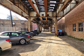 Turning another corner, I was underneath the "L" tracks, and found myself walking through a small private parking lot.