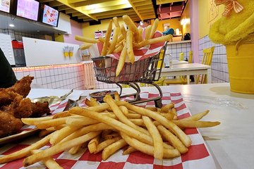 Elyse's french fries came in a tiny little shopping cart.