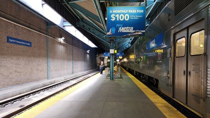 Walking back to the station after verifying the identity of the locomotive.