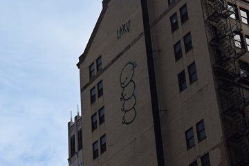 Graffiti on the side of the Standard Club building.  My question is, how did they even manage to access that area in order to tag it?