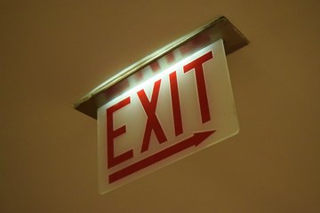 "STAIRS" and "EXIT" signage in the Hancock Center lobby.