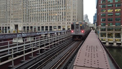 Trains cross the Chicago River, viewed from closer by (though the drone was still a very safe distance away).