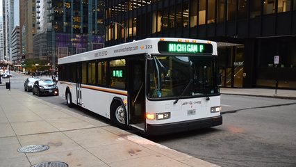 Gillig Low Floor operated by Aries Charter.  Neither of us had ever seen a bus do a scrolling effect on the sign before, nor had we ever seen a side sign that large before.