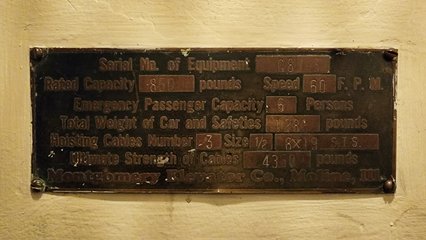 Builder's plate on one of the elevators at Sherman Garden.