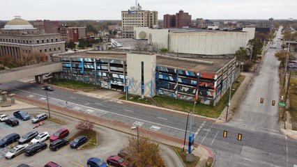 A very brightly painted parking garage sits abandoned across Washington Street from the courthouse.