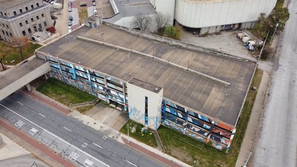 A very brightly painted parking garage sits abandoned across Washington Street from the courthouse.