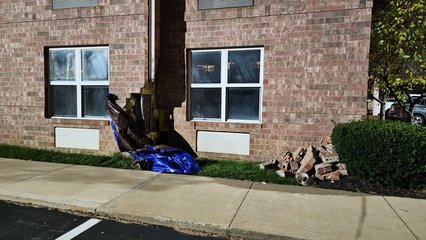 When I went to park the car, I noticed that some bricks were missing from a corner of the hotel.  I suspect that a car had hit it, but I never asked about it, so I don't know for sure.