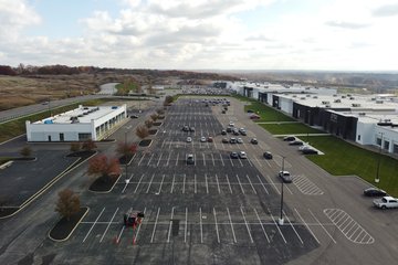 Looking down the center of the former City View Center.  The parking lot has undergone some refurbishment, as the parking lot used to go all the way up to the buildings when it was used for retail, while there is now a wide strip of grass between the buildings and the parking lot.