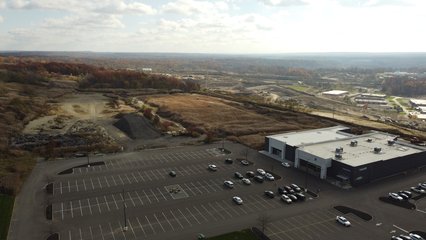 The area beyond the Goodwill building is graded for the second phase of the shopping center that was never built.  This area was to have housed a Home Depot and a JCPenney, as well as several restaurants on pad sites.