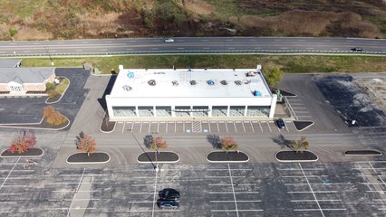 Outparcel building designed to house multiple small tenants.  This appears to have never been leased, based on the clean appearance of the building, as well as the lack of any partitions on the inside.