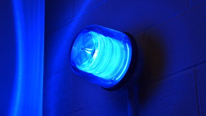 Blue light marking an emergency call box at East 55th Street.