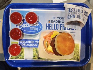 My meal at Culver's consisted of a burger and some of their cheese curds, along with four little cups of ketchup.