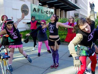 Radical cheerleaders outside AFL-CIO headquarters during the Million Worker March