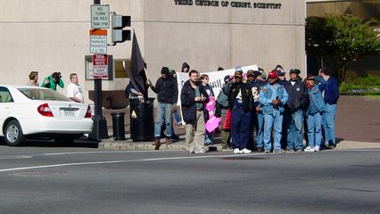 Participants in the feeder march wait to cross the street at the opposite corner of 16th and Eye Streets, and then held up their "Our dreams will never fit in their ballot boxes" banner for all to see while crossing.