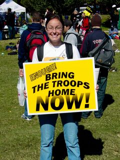 This protester provides criticism of the war on terror in a different way, using the popular slogan of "Bring the troops home NOW!"