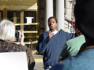 A number of people gave short speeches in front of the Hotel Washington, including Larry Holmes.