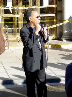 A number of people gave short speeches in front of the Hotel Washington, including Larry Holmes.