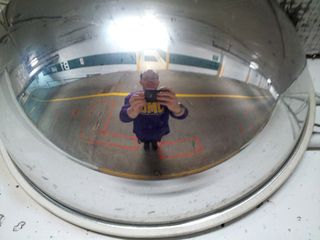 Self-portrait off a mirror in the parking garage at the office.