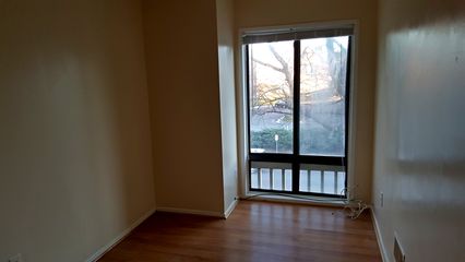 This townhouse had a quad entrance and was also "all stairs".  This layout was typical for a back-to-back, where the living room/dining area and kitchen were on the lowest level, the middle level had two bedrooms and a bathroom, and the top level had the same thing as the middle level.  The washer and dryer were in a corner on the middle level, where there was available space.