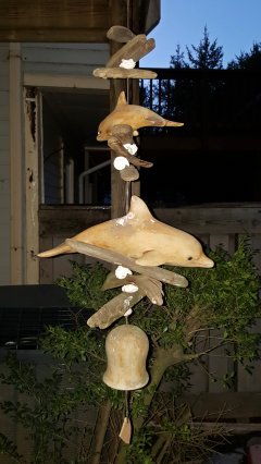 This house also had a minor decorative feature that Elyse really liked: a dolphin wind chime, leading her to call it the "dolphin house".  I found this same exact wind chime online, and it will eventually make an appearance at my house, because let's admit - it's pretty cool.