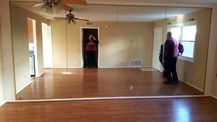 We found this mirrored wall in a townhouse in Aspen Hill.  The mirrors covered a cinderblock wall.  Talk about a rock and a hard place.  I hated those mirrors, but a cinderblock wall was even worse.