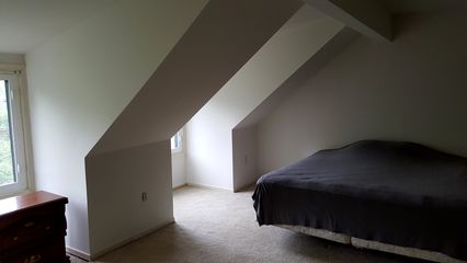 Sometimes you can just see an unpleasant situation from a mile away.  This was the master bedroom in a back-to-back townhouse.  I wondered if I would need to keep a helmet on hand in here, considering that in my one visit to this room, I managed to hit my head on that slanted ceiling several times.  It also reduced the amount of usable space by quite a bit.