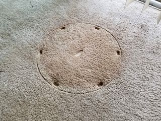 This is the spot where the floor fan sat for my entire time in the apartment.  I was amazed to see how much the sun had faded the carpet over ten years.